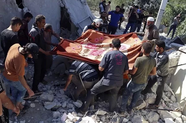 Syrian government forces hit last rebel enclave, killing 9