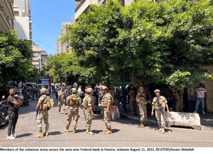 Armed man demanding frozen deposits takes hostages at Lebanese commercial bank