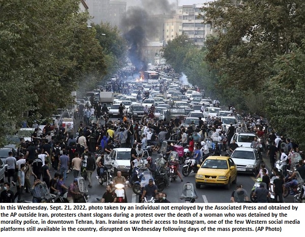 At least 9 killed as Iran protests spread over woman’s death