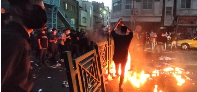 After dark, Iran security forces take aim at protest buildings