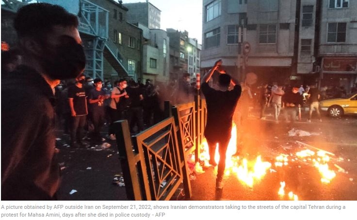 After dark, Iran security forces take aim at protest buildings