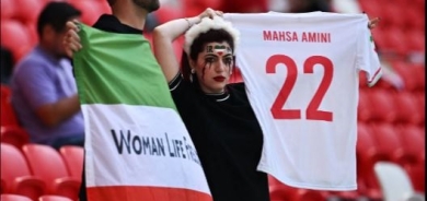 Security escort man wearing pro-Iran protest shirt ahead of match