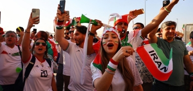 Iranian fans savour victory but wrangle over protests