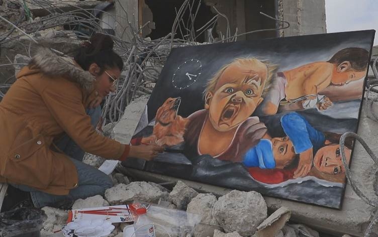 Şêwekareke Efrînî qurbaniyên erdhejê dike tablo