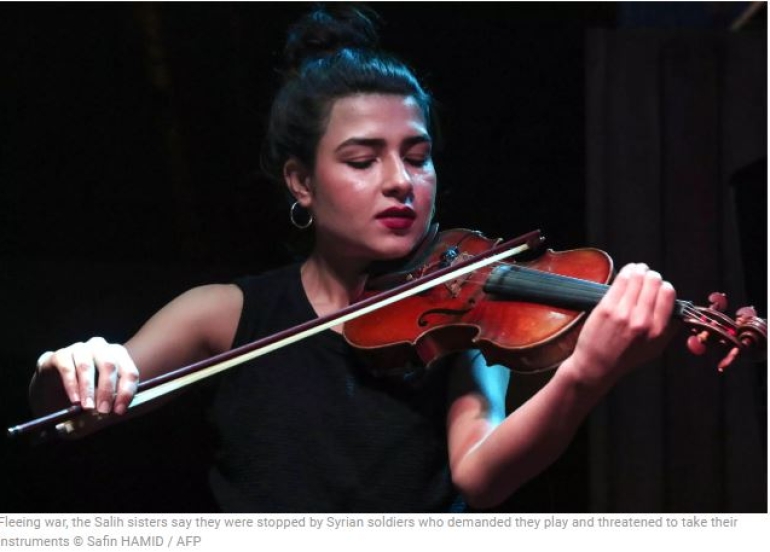 After IS and bombs, refugee sisters sing of Kurdish sorrow