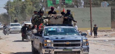 Milîsên Iraqî gefê li Amerîkayê dixwen