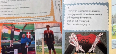 Keçeke Kurd a Efrînî li Danîmarkayê Ala Kurdistanê dixe pirtûkeke dibistanê