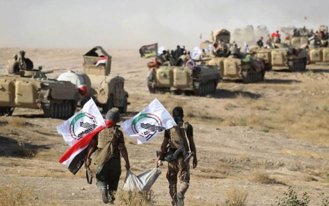 الحشد الشعبي يتهم الأمريكان بتقديم السلاح إلى عناصر 