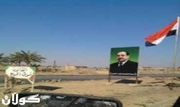 نائب بالوسط: وضع صور المالكي في السيطرات يدل على 