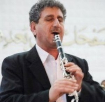 علي خصاف مايسترو وقائد سفمونية ..أصغر مشارك في الجوق المنتخب للسفر الى يوغسلافيا عام 1977