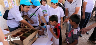 Kurdish students help prepare Syrian refugee children's return to school in northern Iraq