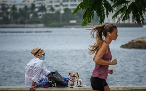 Some Florida beaches reopen amid virus surge, New York cases fall