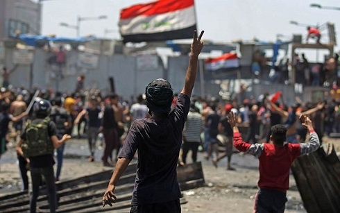 Iraq protests flare up again as new government sworn in