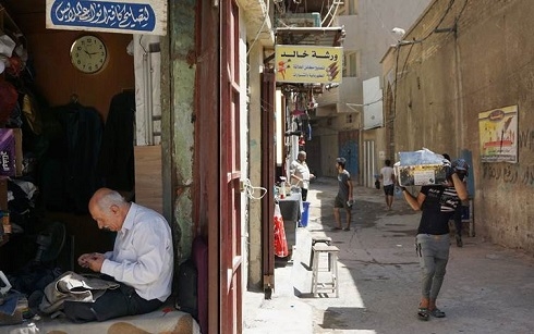 Iraqis are losing jobs, eating less as COVID-19 devastates economy: survey