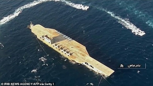 Iran's navy shoots missile at mock-up of US aircraft carrier in the Strait of Hormuz