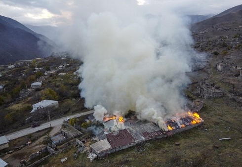 Armenians torch their homes on land ceded to Azerbaijan