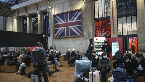 Travel bans hit Britain as WHO says new virus strain can be contained