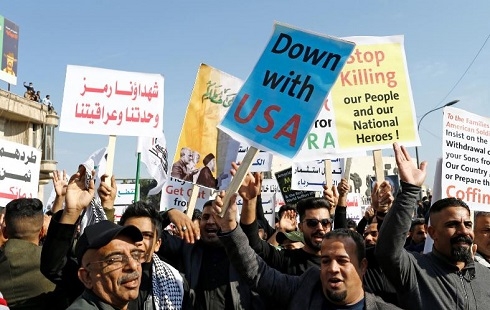 Chanting anti-US slogans, Iraq militia supporters mark year since Soleimani's killing