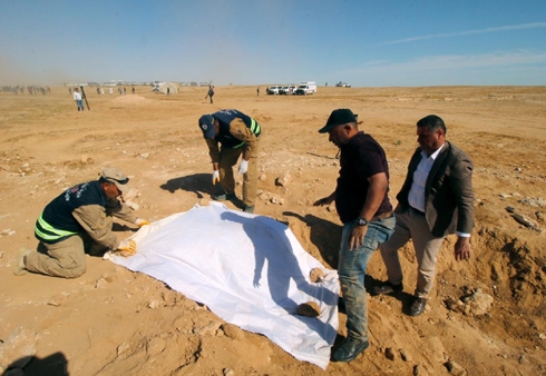 Iraq unearths mass grave of Kurds killed by Saddam