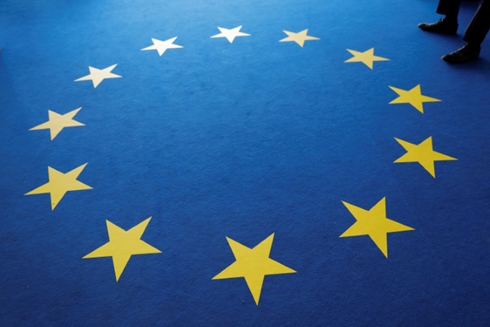 Macron confronts Merkel as top EU job tussle begins