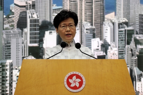 Hong Kong leader suspends extradition bill, says sorry