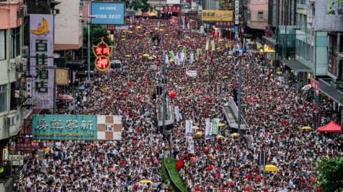 Thousands of protesters march through Hong Kong against government