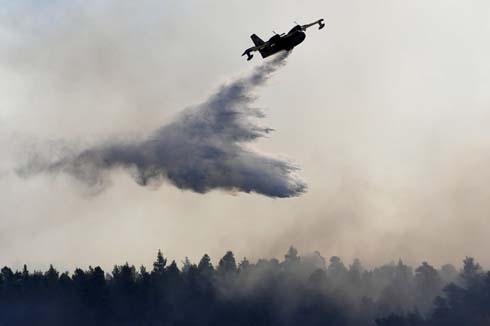 Firefighting planes battle blaze on Greek island of Evia