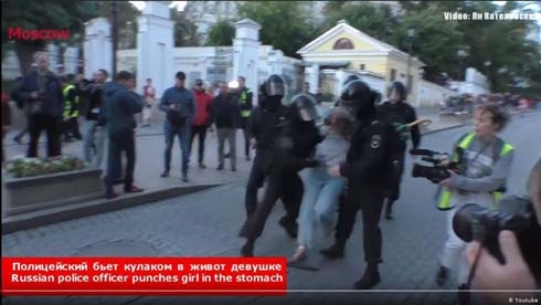 Russian police caught on camera punching female protester in stomach