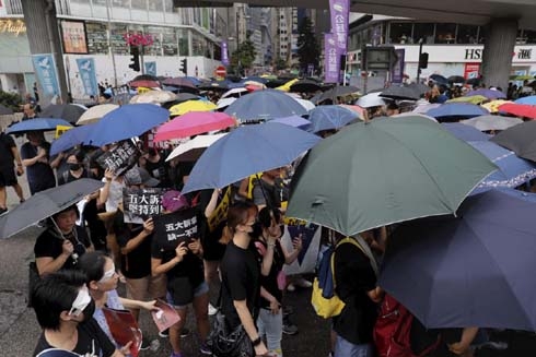 Hong Kong protesters brave strong winds, rain to attend latest rally