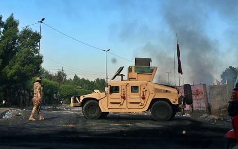 Gunfire shatter brief calm in Iraq, protests restart
