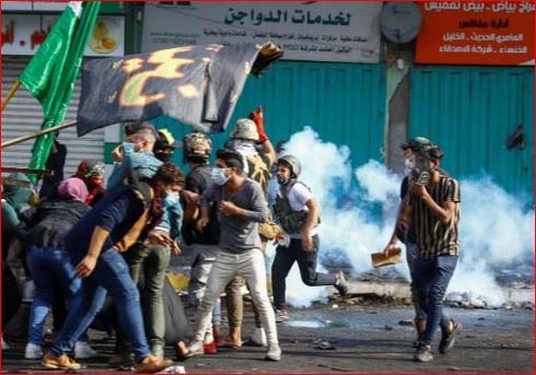 Iraqi forces kill four in Baghdad but protesters stay put -police, medics