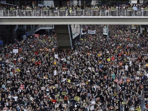 London summons China envoy over 'brutal' treatment of HK staffer