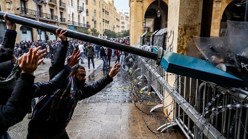 Lebanon protesters lob traffic signs, branches at police