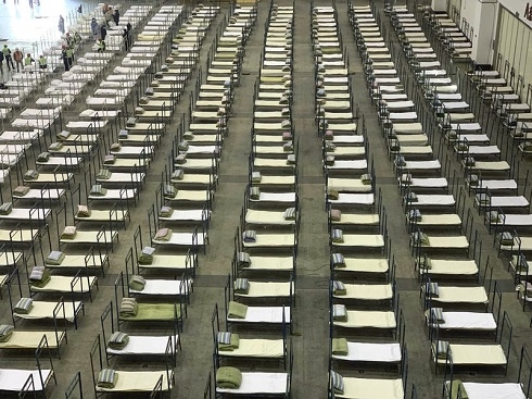 Hong Kong reports virus death as workers strike at hospitals