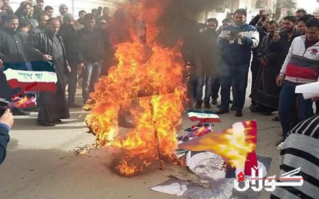 لەناوەڕاستی بەغدا خۆپیشاندەرێک ئاڵای عێراق دەسوتێنێت 